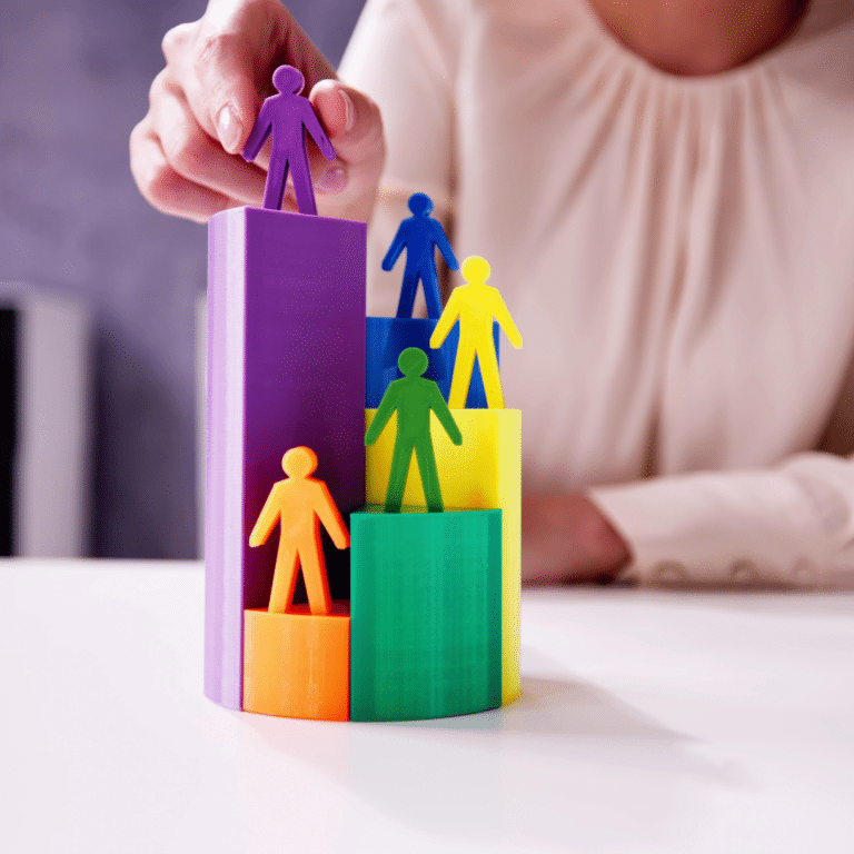 Colorful ascending blocks with figurines on top depicting the growth and segmentation of an email subscriber base during a warm-up campaign