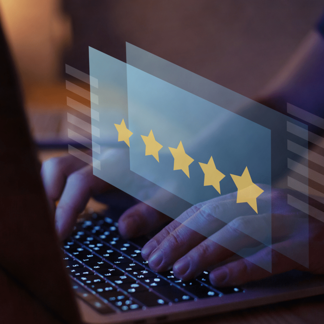 A transparent five-star rating overlay on a laptop keyboard, illustrating the goal of achieving high sender reputation through successful email warm-up practices
